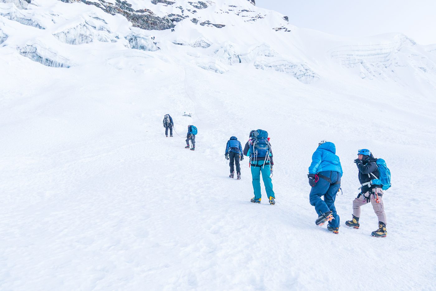 Climbing team ascending the glacier on Island Peak